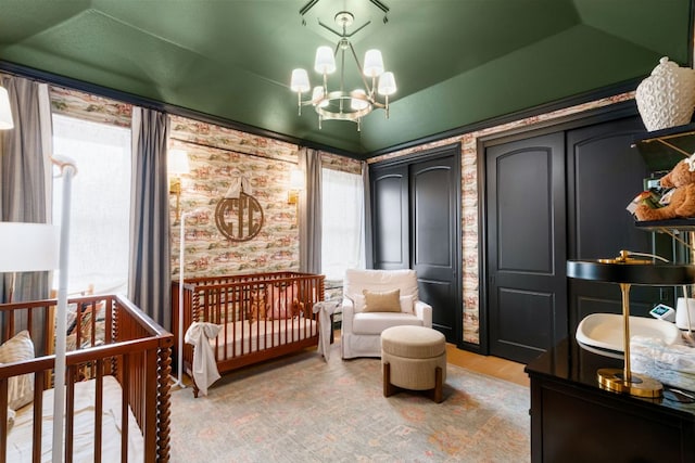 2621 Exposition Blvd, Austin, TX 78703 - bedroom featuring multiple windows, a chandelier, light wood-type flooring, and wallpapered walls