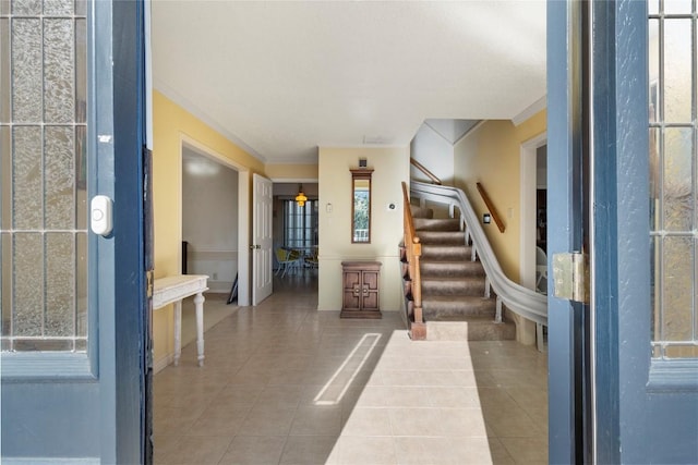 6203 Shadow Mountain Cv, Austin, TX 78731 - tiled entrance foyer with ornamental molding, stairway, and baseboards