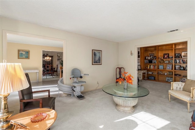 6203 Shadow Mountain Cv, Austin, TX 78731 - sitting room with carpet floors and a chandelier