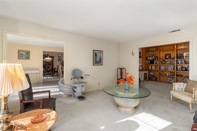 6203 Shadow Mountain Cv, Austin, TX 78731 - sitting room with carpet flooring and a chandelier