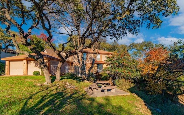 6203 Shadow Mountain Cv, Austin, TX 78731 - view of front of house with a front lawn and an attached garage