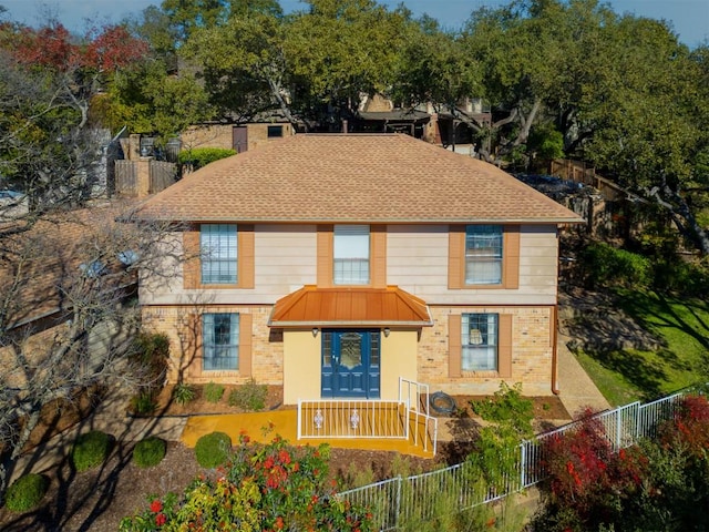 6203 Shadow Mountain Cv, Austin, TX 78731 - view of front of house featuring brick siding, a fenced backyard, and roof with shingles