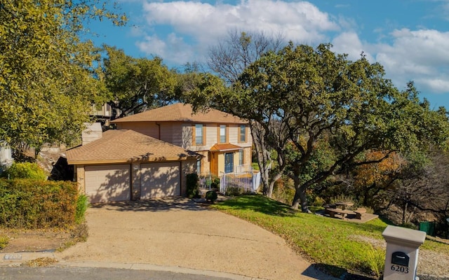 6203 Shadow Mountain Cv, Austin, TX 78731 - traditional home with a garage, driveway, a front yard, and a chimney