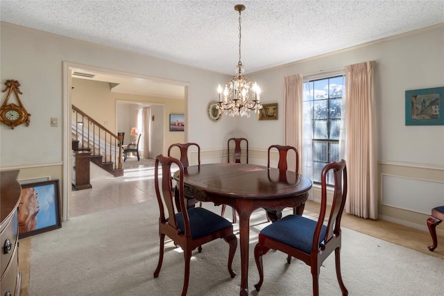 6203 Shadow Mountain Cv, Austin, TX 78731 - dining space featuring stairway, light colored carpet, a textured ceiling, a chandelier, and light tile patterned flooring