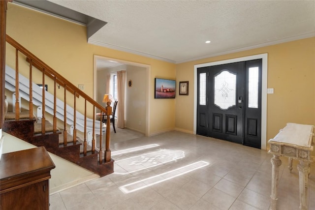 6203 Shadow Mountain Cv, Austin, TX 78731 - tiled foyer featuring ornamental molding, a textured ceiling, stairs, baseboards, and recessed lighting