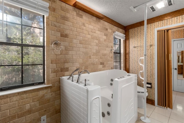 6203 Shadow Mountain Cv, Austin, TX 78731 - full bath with tile patterned flooring, a jetted tub, and a textured ceiling