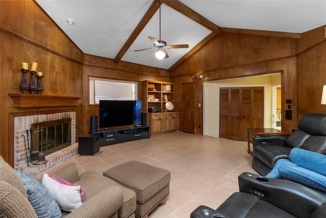 6203 Shadow Mountain Cv, Austin, TX 78731 - living room with wood walls, a ceiling fan, a brick fireplace, and light tile patterned floors