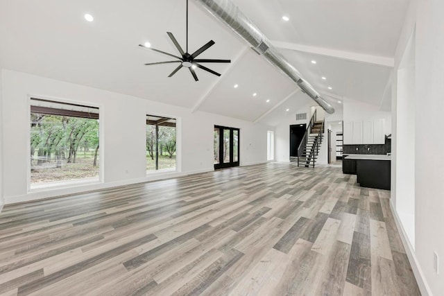 4190 W Fm 243, Bertram, TX 78605 - unfurnished living room with beamed ceiling, a ceiling fan, plenty of natural light, recessed lighting, and high vaulted ceiling