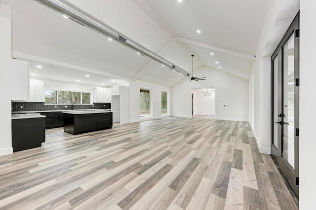 4190 W Fm 243, Bertram, TX 78605 - unfurnished living room featuring recessed lighting, ceiling fan, light wood-style floors, a sink, and high vaulted ceiling