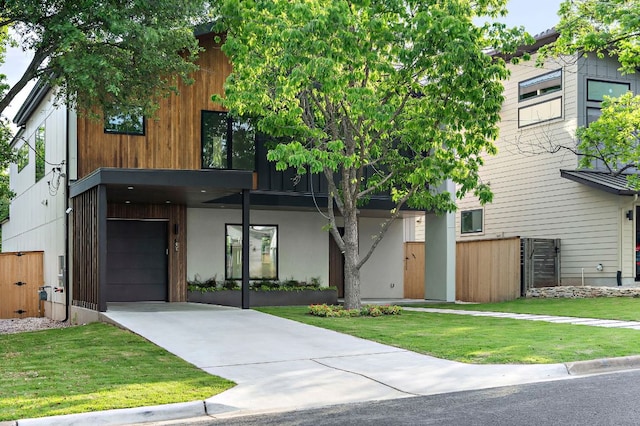 1805 Frazier Ave, Austin, TX 78704 - modern home featuring an attached garage and concrete driveway