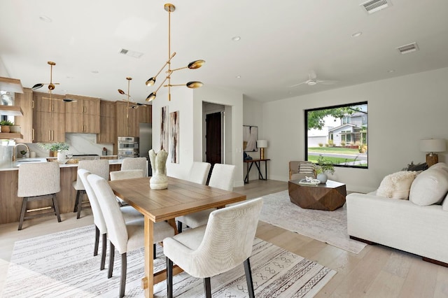 1805 Frazier Ave, Austin, TX 78704 - dining area featuring light wood-style flooring and a ceiling fan