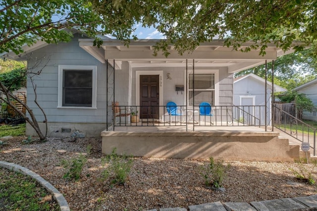 1706 Pennsylvania Ave, Austin, TX 78702 - view of front of property with crawl space and covered porch