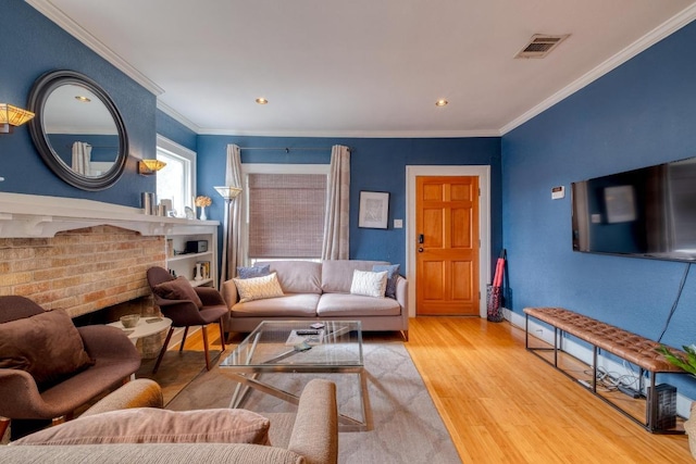 1706 Pennsylvania Ave, Austin, TX 78702 - living room featuring wood finished floors, crown molding, and recessed lighting