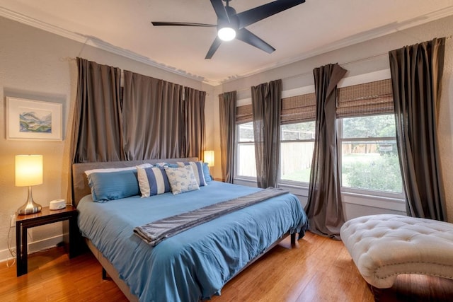 1706 Pennsylvania Ave, Austin, TX 78702 - bedroom with wood finished floors, crown molding, and a ceiling fan