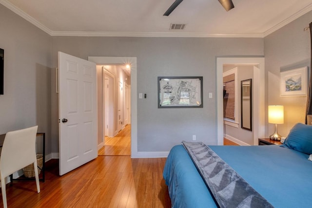1706 Pennsylvania Ave, Austin, TX 78702 - bedroom featuring light wood-type flooring, crown molding, and a ceiling fan