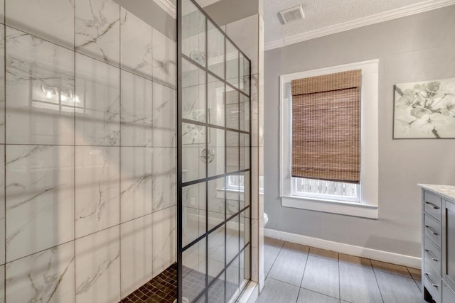 1706 Pennsylvania Ave, Austin, TX 78702 - bathroom with crown molding, a shower stall, vanity, a textured ceiling, and tile patterned flooring