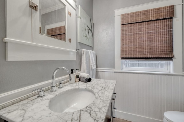 1706 Pennsylvania Ave, Austin, TX 78702 - bathroom featuring vanity and a wainscoted wall