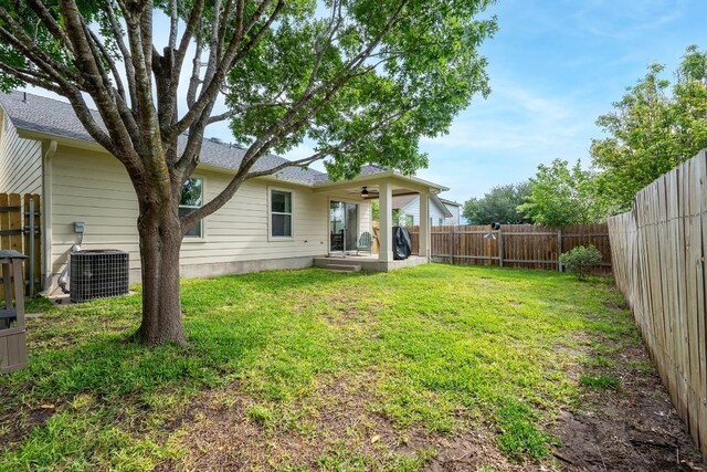 509 Big Bend Trl, Taylor, TX 76574 - view of yard featuring central AC, ceiling fan, and a patio area