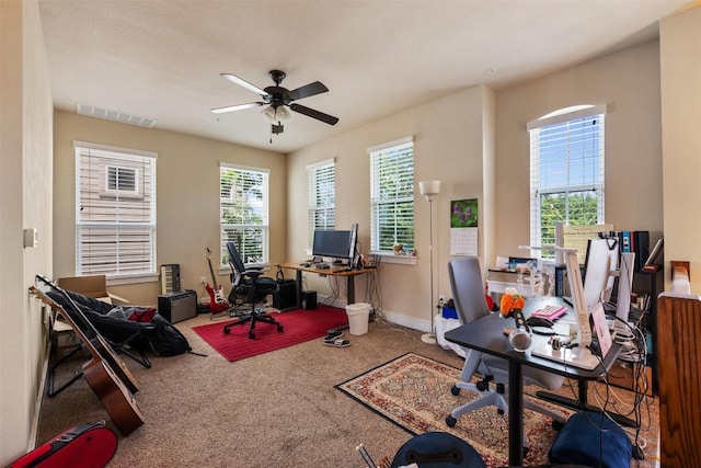 7706 Easy Wind Dr, Austin, TX 78757 - carpeted home office with a ceiling fan and baseboards