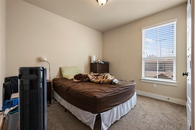 7706 Easy Wind Dr, Austin, TX 78757 - carpeted bedroom featuring baseboards