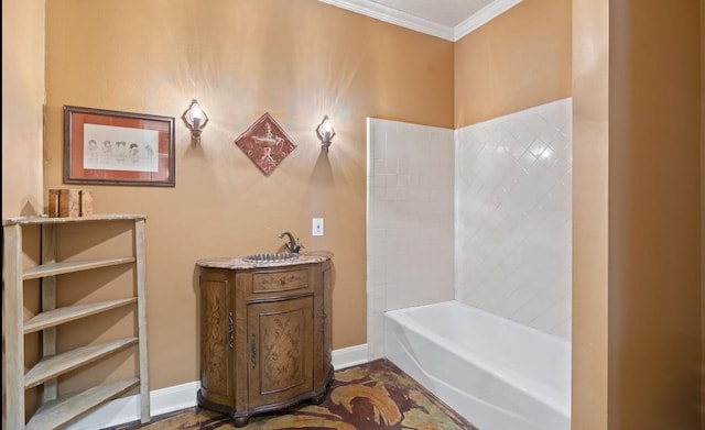 762 S Guadalupe St, Lockhart, TX 78644 - bathroom featuring ornamental molding, baseboards, a bath, and a sink
