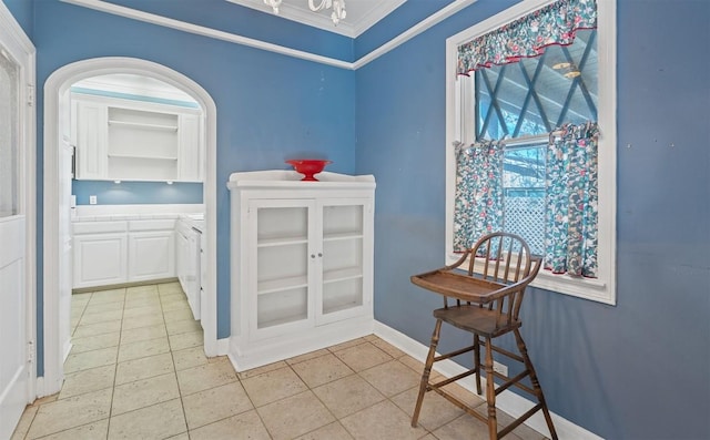 762 S Guadalupe St, Lockhart, TX 78644 - dining area featuring ornamental molding, light tile patterned floors, and baseboards