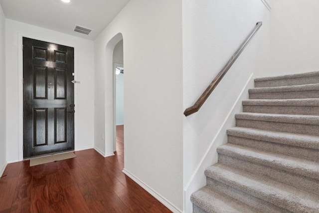 104 Kulmbacher Dr, Austin, TX 78728 - entrance foyer featuring arched walkways, wood finished floors, stairs, and baseboards