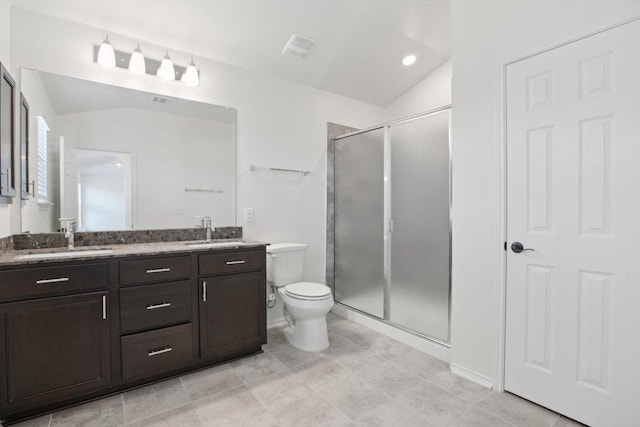 104 Kulmbacher Dr, Austin, TX 78728 - full bath with double vanity, toilet, a stall shower, vaulted ceiling, and tile patterned flooring