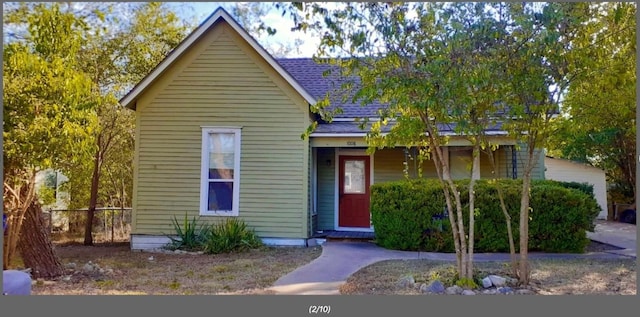 1008 Washburn St, Taylor, TX 76574 - bungalow-style home with roof with shingles and a porch