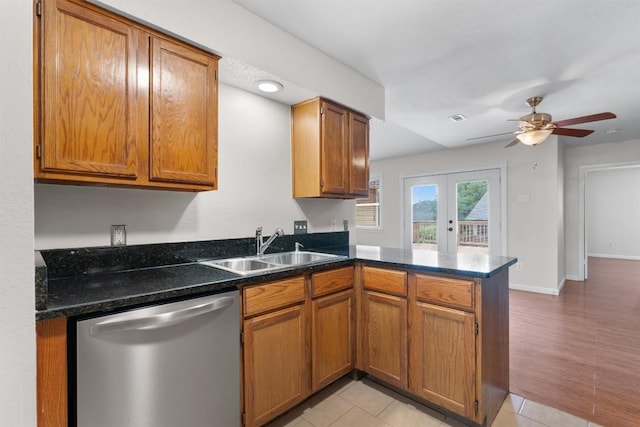 8407 Bargamin Dr, Austin, TX 78736 - kitchen featuring dishwasher, a peninsula, a sink, and brown cabinetry