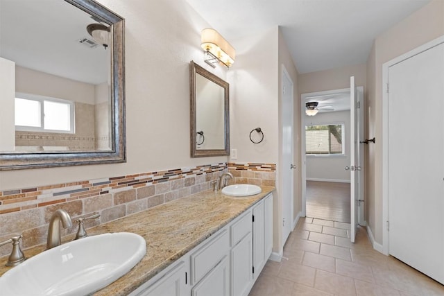 8407 Bargamin Dr, Austin, TX 78736 - full bath with baseboards, tile patterned flooring, double vanity, and plenty of natural light
