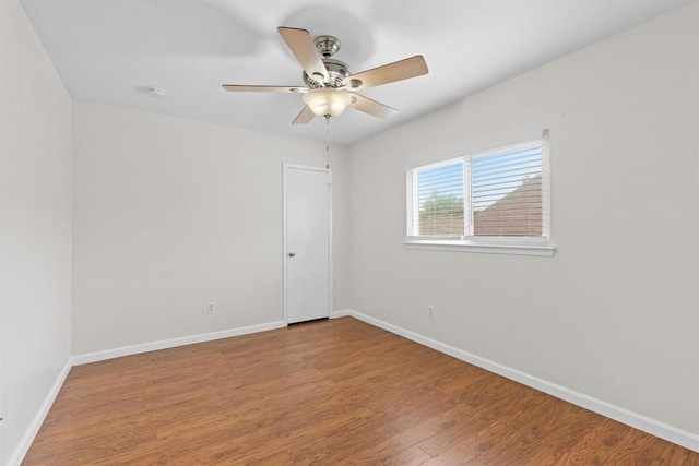 8407 Bargamin Dr, Austin, TX 78736 - unfurnished room featuring ceiling fan, baseboards, wood finished floors, and a smoke detector