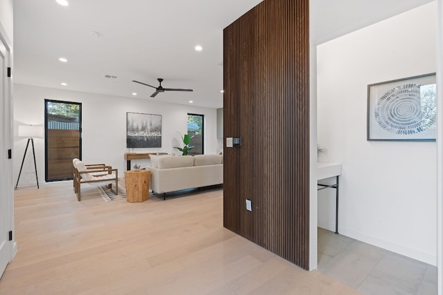 2704 Canterbury St Unit A, Austin, TX 78702 - living area with ceiling fan, recessed lighting, light wood-style floors, and baseboards