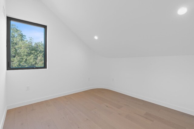 2704 Canterbury St Unit A, Austin, TX 78702 - additional living space with vaulted ceiling, light wood-style floors, baseboards, and recessed lighting