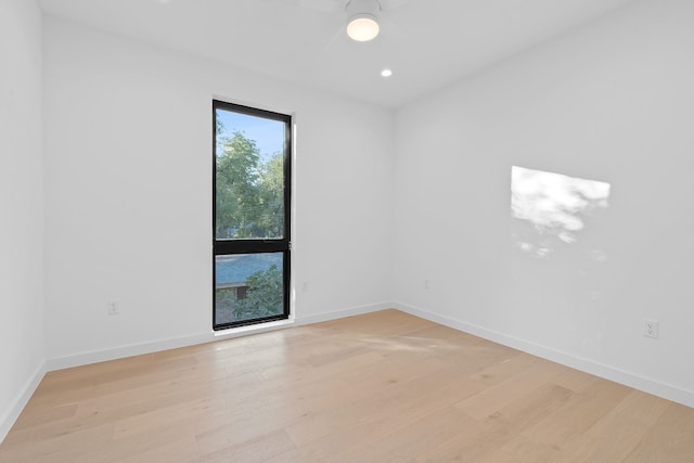 2704 Canterbury St Unit A, Austin, TX 78702 - empty room with light wood-type flooring, baseboards, recessed lighting, and ceiling fan