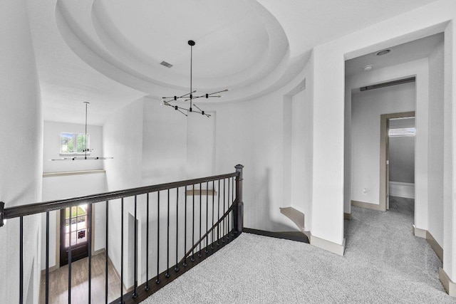8108 Turning Leaf Cir, Lago Vista, TX 78645 - hall with an upstairs landing, a chandelier, baseboards, and carpet floors