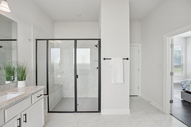2436 Capestrano Cir, Round Rock, TX 78665 - bathroom featuring marble look tile flooring, vanity, and a marble finish shower