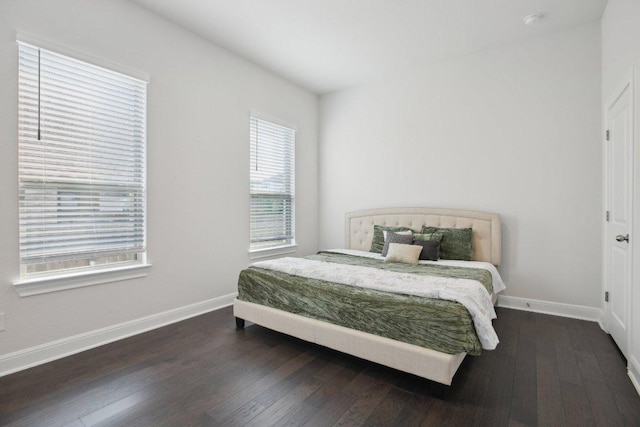2436 Capestrano Cir, Round Rock, TX 78665 - bedroom with dark wood-type flooring and baseboards