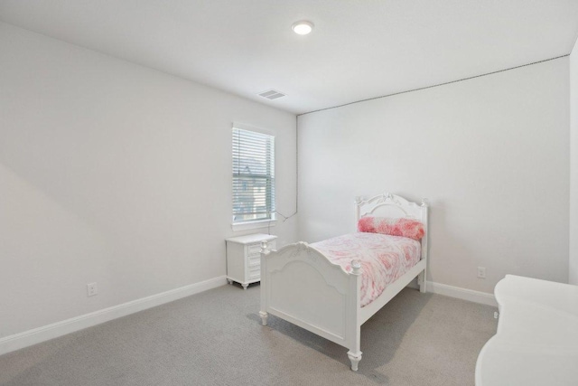 2436 Capestrano Cir, Round Rock, TX 78665 - bedroom featuring light carpet and baseboards