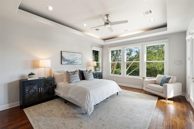 512 Newhall Cv, Austin, TX 78746 - bedroom featuring a tray ceiling, baseboards, multiple windows, and recessed lighting
