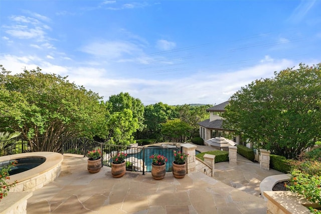512 Newhall Cv, Austin, TX 78746 - view of patio / terrace with an in-ground hot tub