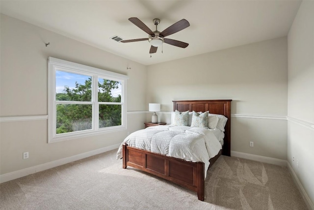 512 Newhall Cv, Austin, TX 78746 - bedroom with light carpet, baseboards, and a ceiling fan