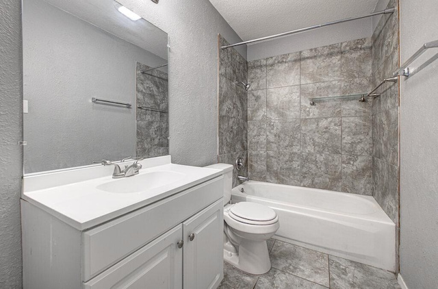 4401 Teri Rd, Austin, TX 78744 - bathroom with toilet, a textured wall, vanity, and shower / tub combination