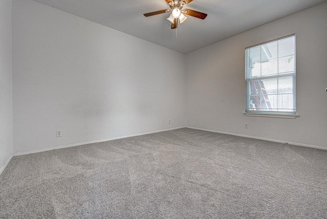 4401 Teri Rd, Austin, TX 78744 - empty room featuring carpet floors, ceiling fan, and baseboards
