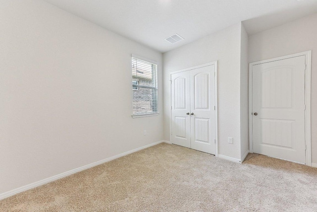 208 Charles Trl, Georgetown, TX 78626 - unfurnished bedroom with light colored carpet, a closet, and baseboards