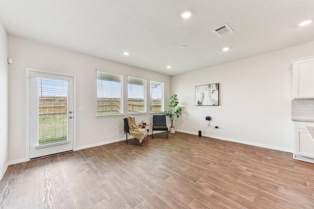 208 Charles Trl, Georgetown, TX 78626 - sitting room featuring plenty of natural light, light wood finished floors, recessed lighting, and baseboards