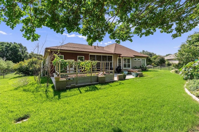282 Trail Of The Flowers, Georgetown, TX 78633 - rear view of property with a sunroom, a patio, and a vegetable garden