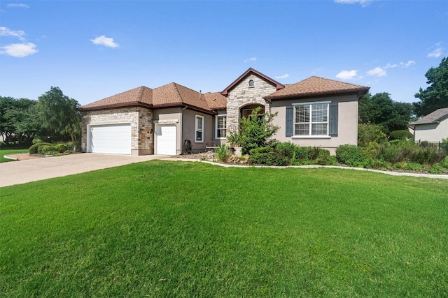 282 Trail Of The Flowers, Georgetown, TX 78633 - view of front of house featuring stone siding, a front yard, and a garage