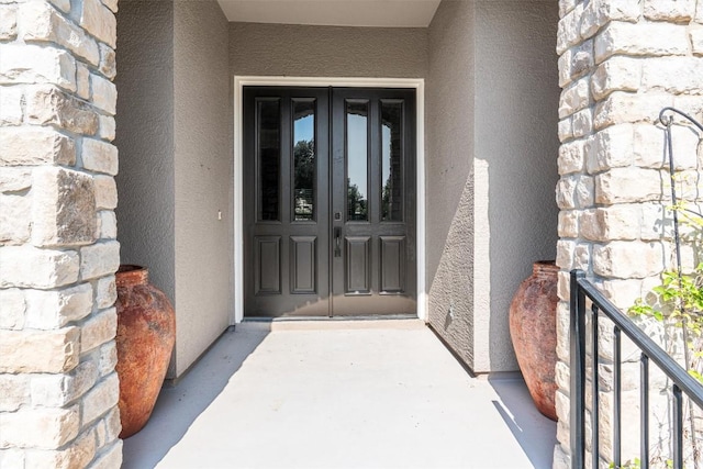 282 Trail Of The Flowers, Georgetown, TX 78633 - doorway to property featuring stucco siding and french doors