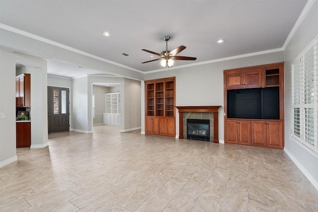 282 Trail Of The Flowers, Georgetown, TX 78633 - unfurnished living room featuring baseboards, a ceiling fan, recessed lighting, a fireplace, and crown molding